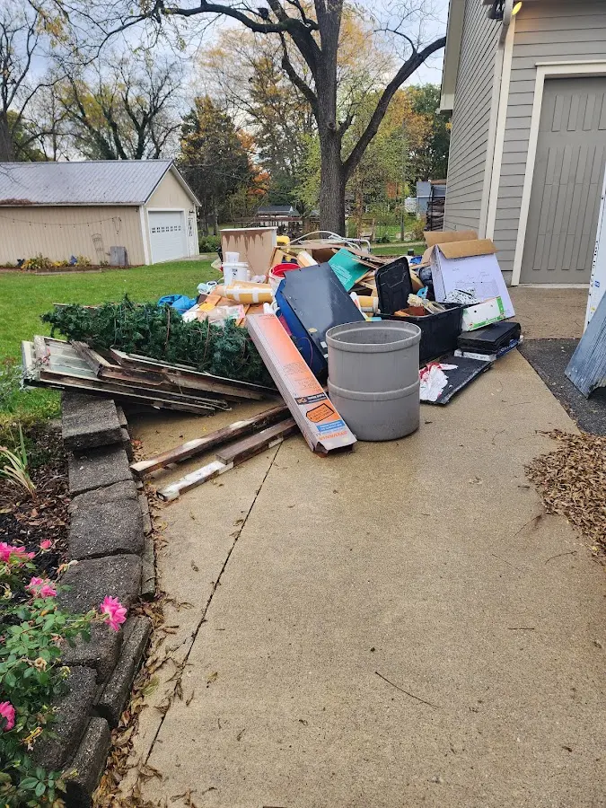 Dumpster being loaded with debris for Demolition Dumpster Rental in Shelby